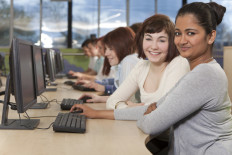 Group of Students Using Computers at College